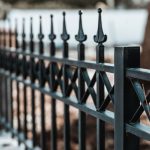 A closeup shot of an iron fence